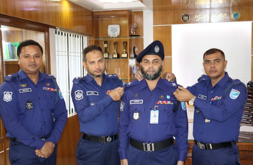 Gazipur Police Superintendent Md. Sharif Uddin puts rank badge on promoted ASI Md. Habil Uddin